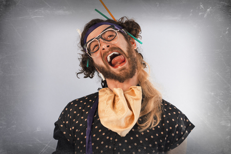 Bearded crazy person lunatic wearing several pairs of glassesの写真素材