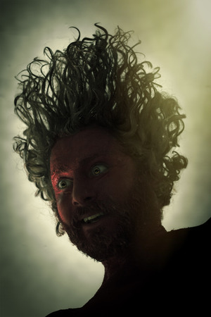 Demon monster man with beard and frightening eyesの写真素材