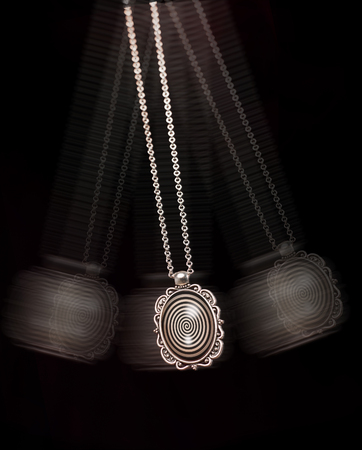 Hypnosis treatment tool swinging back and forthの写真素材