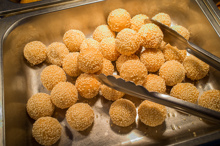 Chinese dessert sesame donuts in self serve buffet trayの写真素材