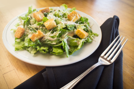 Fresh organic caesar salad with grated asiago cheeseの写真素材