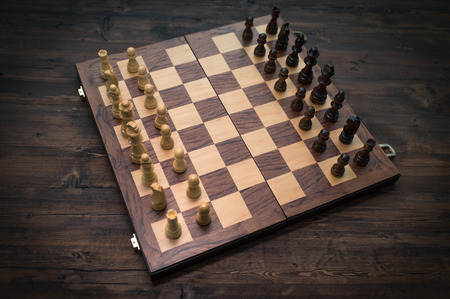 Chess pieces and board set up for beginning of game