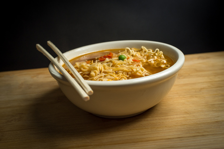 Spicy asian ramen noodle soup with chopsticksの写真素材