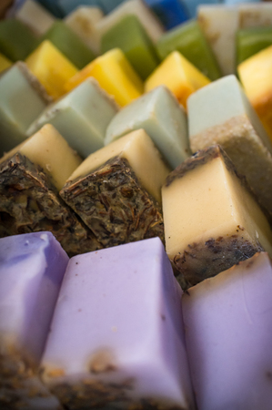 Columns and rows of various colorful homemade bar soapsの写真素材