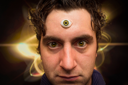 Handsome male fortune teller with magic third eye