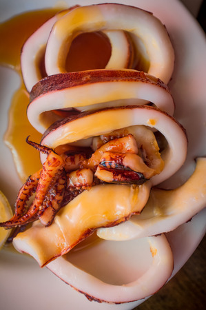 Tasty barbecue teriyaki squid with lemon and tentacles