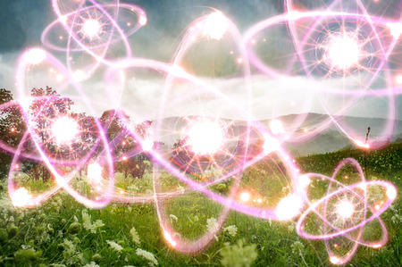 Magical landscape field with mountains and atomic particles