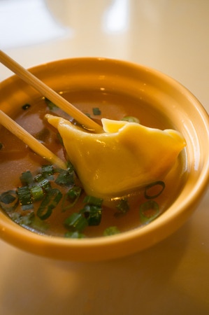 Authentic chinese food wonton soup with green onionの写真素材