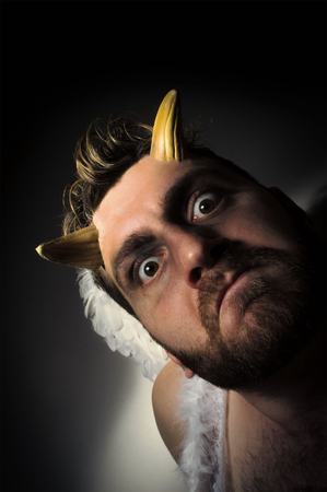 Fallen angel satan with feathered wings and moody lighting