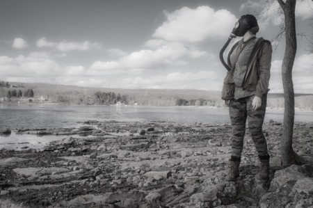 Scary girl wearing authentic Russian gas mask with breathing hoseの写真素材