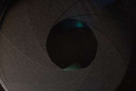 Closeup macro diaphragm of camera lens showing aperture bladesの写真素材