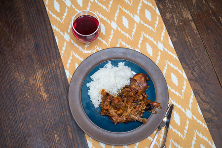Slow cooked French Coq Au Vin with fluffy white riceの写真素材