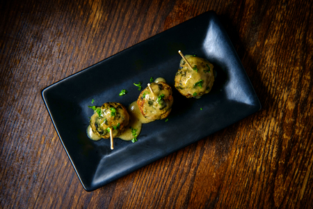 Delicious swedish meatballs with sauce on rustic wooden tableの写真素材
