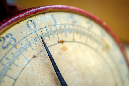 Old fashioned red antique weight measuring scale
