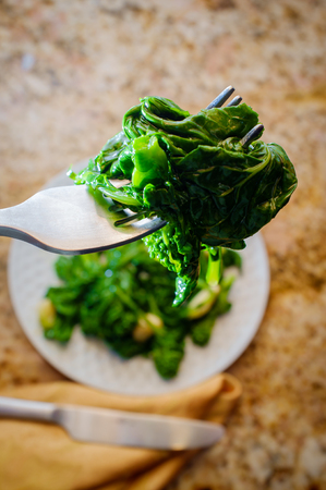 Sauteed broccoli rabe with sweet garlic garlicの写真素材