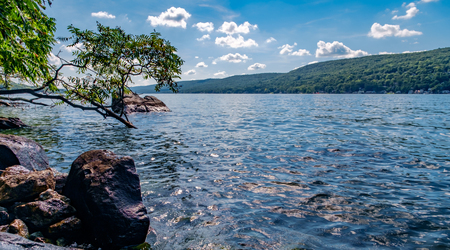 Scenic view of Greenwood lake on summer day with cloudscapeの写真素材