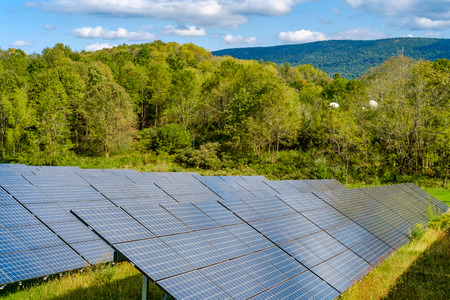 Solar panels absorbing the suns energy on autumn day
