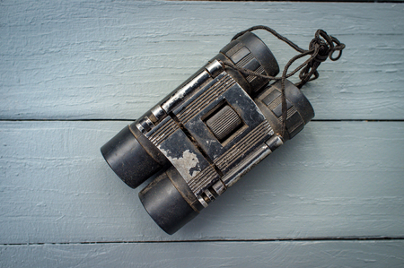Old worn metal binoculars used for bird watching and ornithologyの写真素材