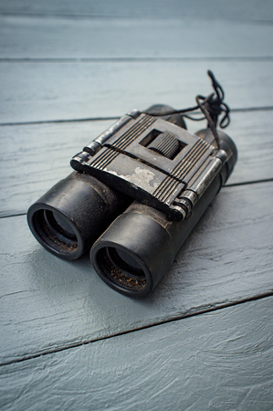 Old worn metal binoculars used for bird watching and ornithologyの写真素材