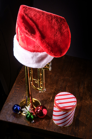 Seasonal Christmas and the holidays musical instrument trumpet with dramatic lightingの写真素材