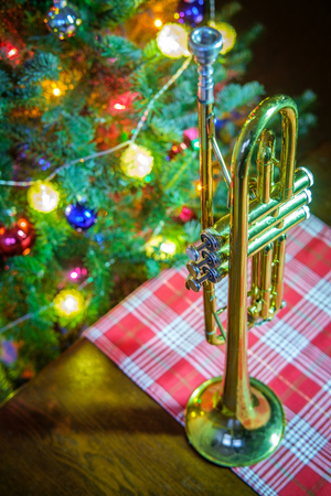 Seasonal Christmas and the holidays musical instrument trumpet with dramatic lightingの写真素材