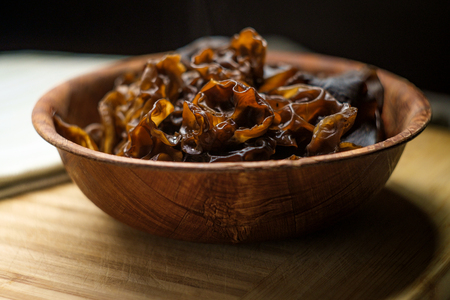 Cooked Chinese wood ear mushrooms in wooden bowlの写真素材
