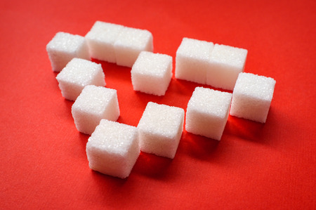 Diabetes bloodsugar and heart health concept with sugar cubesの写真素材