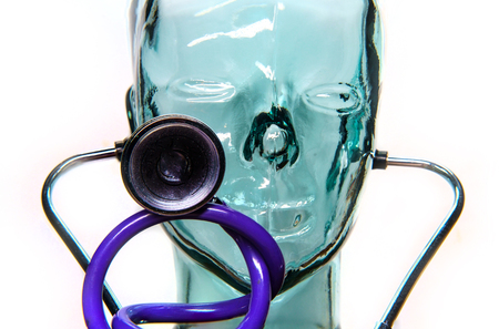 Robotic humanoid wears stethoscope for medical automation conceptの写真素材