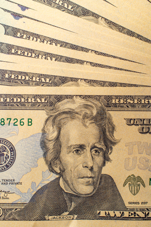 Pile of USA currency American twenty dollar bills for banking and finance background