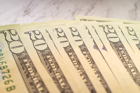 Pile of USA currency American twenty dollar bills for banking and finance background