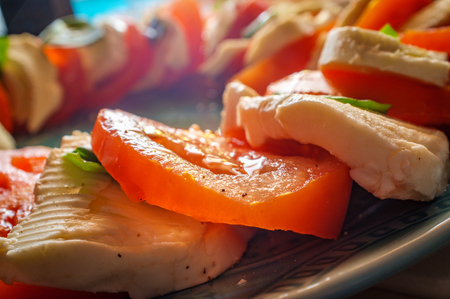 Fresh caprese salad with extra virgin olive oil and salt pepperの写真素材