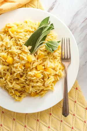 Traditional Portuguese butternut squash orzo with sage butterの写真素材