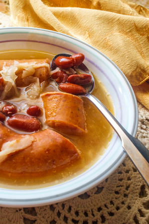 Traditional Polish sauerkraut kielbasa sausage and bean soupの写真素材