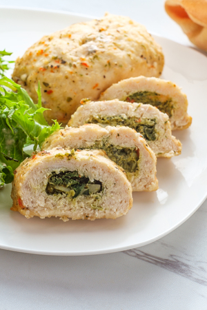 Herbed Mediterranean stuffed chicken breast with side saladの写真素材