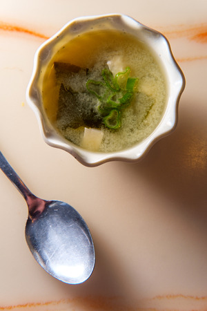 Japanese miso soup bowl with soft tofu and seaweedの写真素材