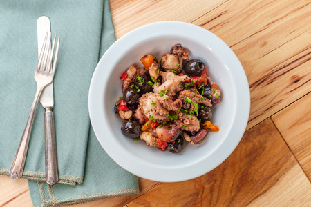 Spanish Octopus a La Vinagreta with oil and vinegar marinated kalamata olives and bell peppersの写真素材