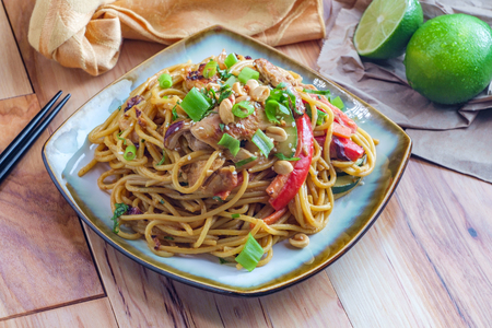 Spicy Thai chicken peanut butter lo mein noodles with sesame seedsの写真素材