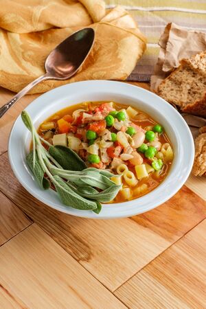 Hearty Italian minestrone soup with sausage and ditalini pastaの写真素材