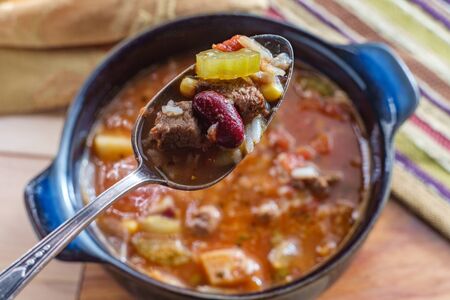 Slow cooker beef and vegetables soup with kidney beans and riceの写真素材