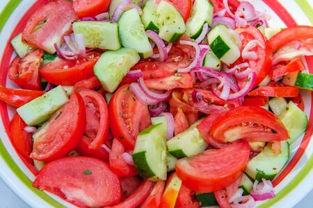 Fresh healthy cucumber salad with tomatoes summer side dishの写真素材