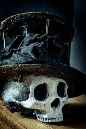 Scary jawless Halloween skull wearing old distressed top hatの写真素材