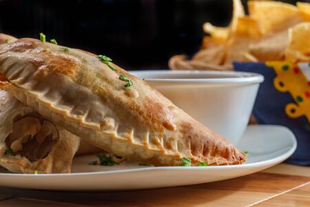 Mexican beef empanadas with tortilla chips and restaurant style salsaの写真素材