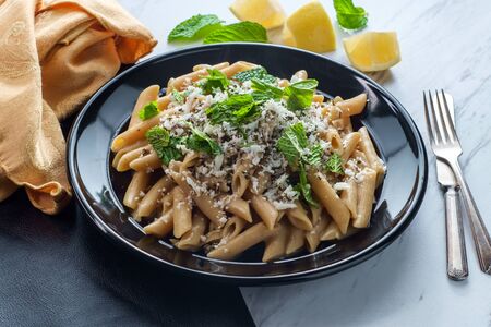 Greek halloumi cheese pasta with mint and lemon juiceの写真素材