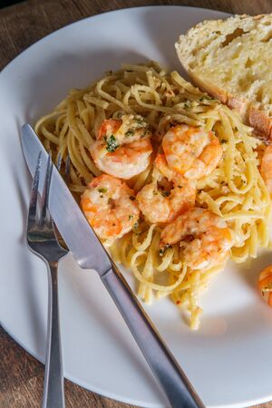 Italian shrimp with linguine Gamberoni Aglio e Olioの写真素材