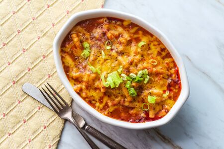 Baked American goulash one-pot meal cheesy beef and macaroni pasta in casserole dishの写真素材