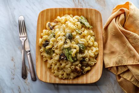 Veggie mac and cheese with roasted brussels sprouts broccoli and cauliflower