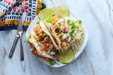 Crispy fried boom boom shrimp tacos with riceの写真素材