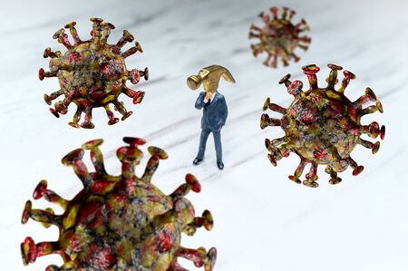 Ignorant hammer head businessman ignoring the coronavirus epidemic conceptの写真素材