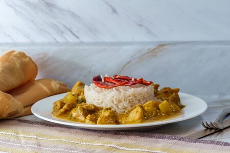 Authentic spicy Indian chicken korma curry with jasmine rice gluten freeの写真素材
