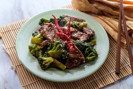 Szechuan stir fried beef with broccoli and hot peppersの写真素材